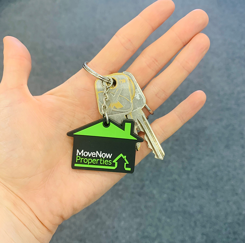 MoveNow Keyring on keys in palm of hand