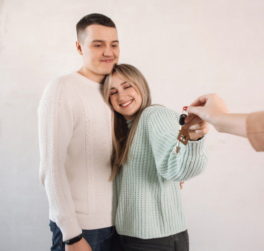 Passing house keys to couple